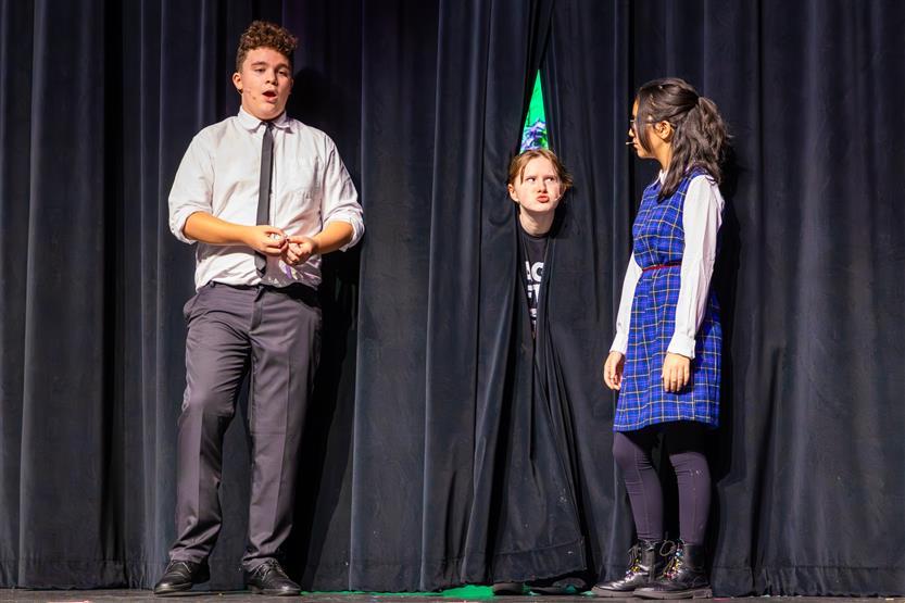 Students perform onstage